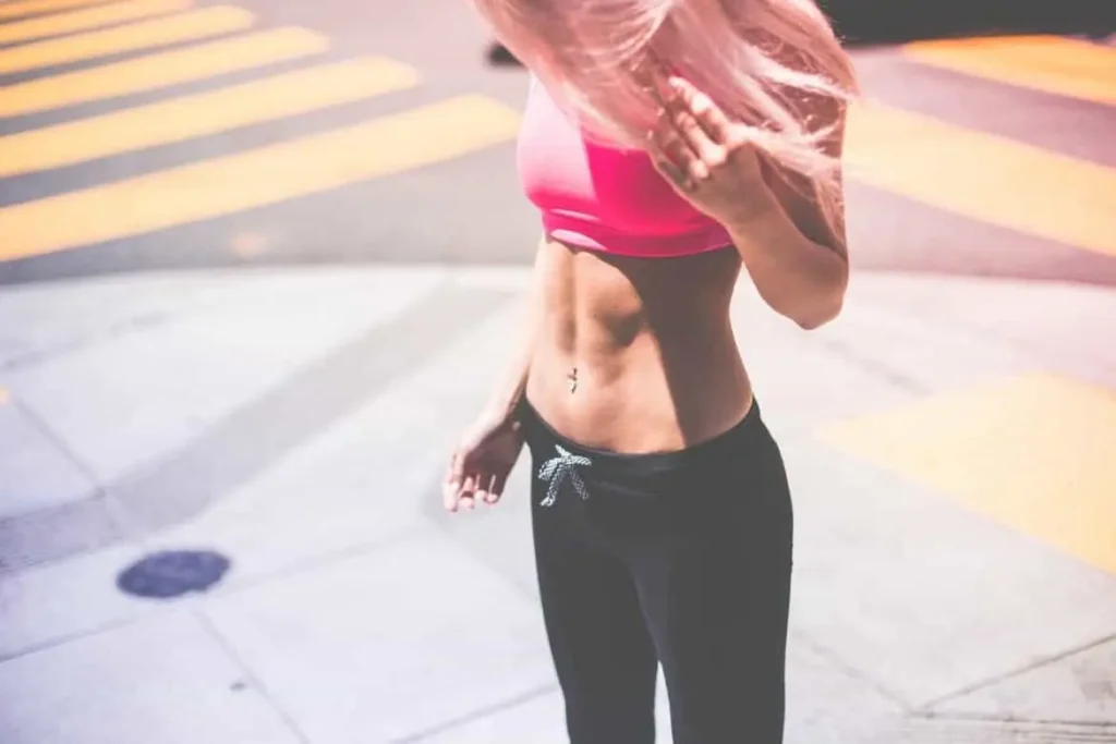 Woman with toned stomach after LA-EMS Body Sculpting Treatment Lincoln